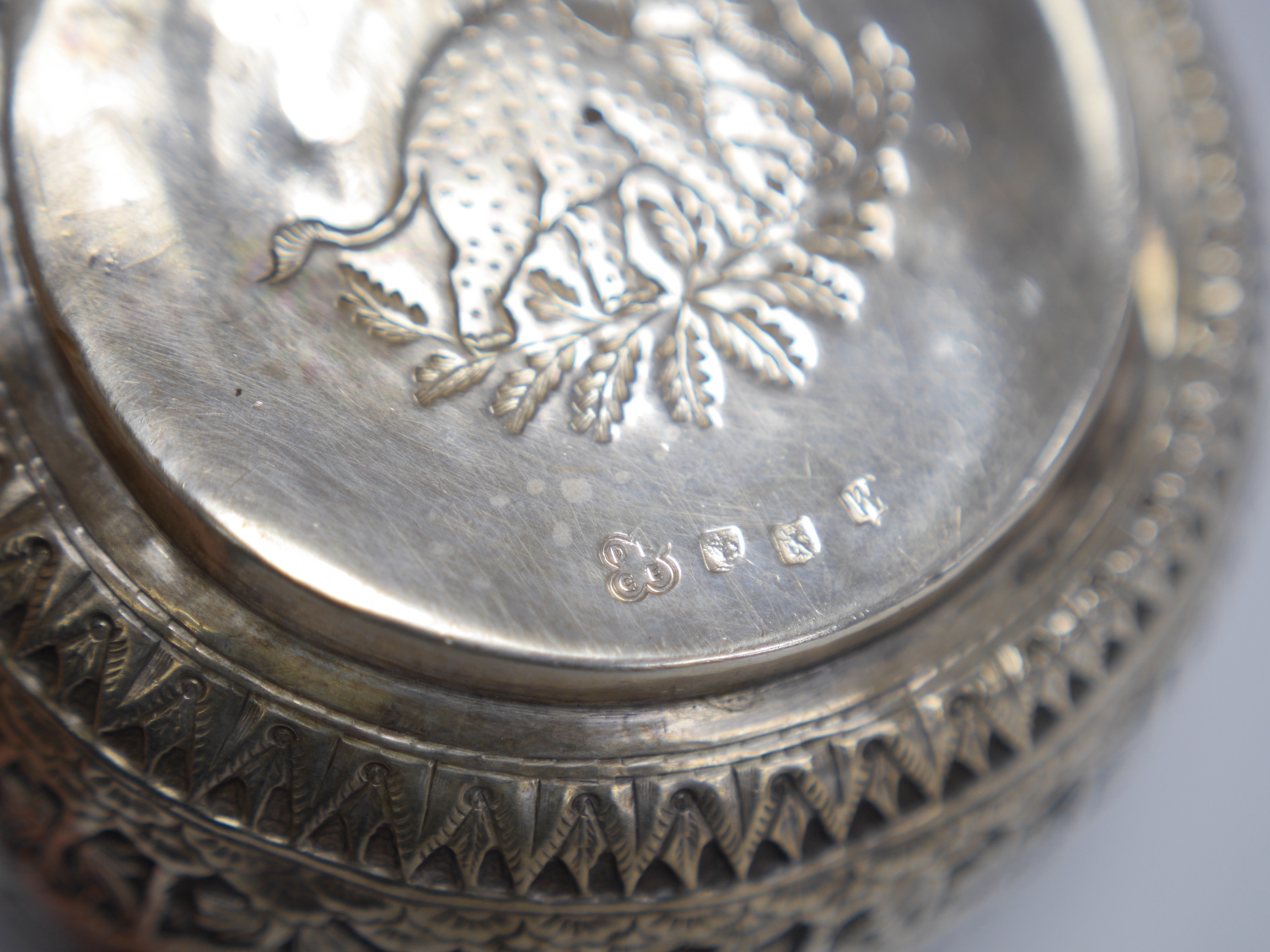 A late Victorian Scottish embossed silver bowl, in the Burmese style, David & George Edwards, Glasgow, 1893, diameter 11.2cm, 4.8oz. Condition - poor to fair